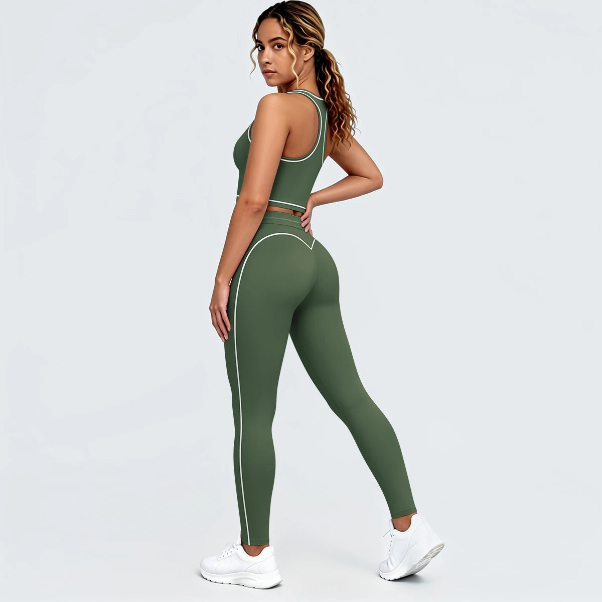 Yoga-Set aus Sport-Top und Leggings, moosgrün, mit hellen Paspeln an Konturen