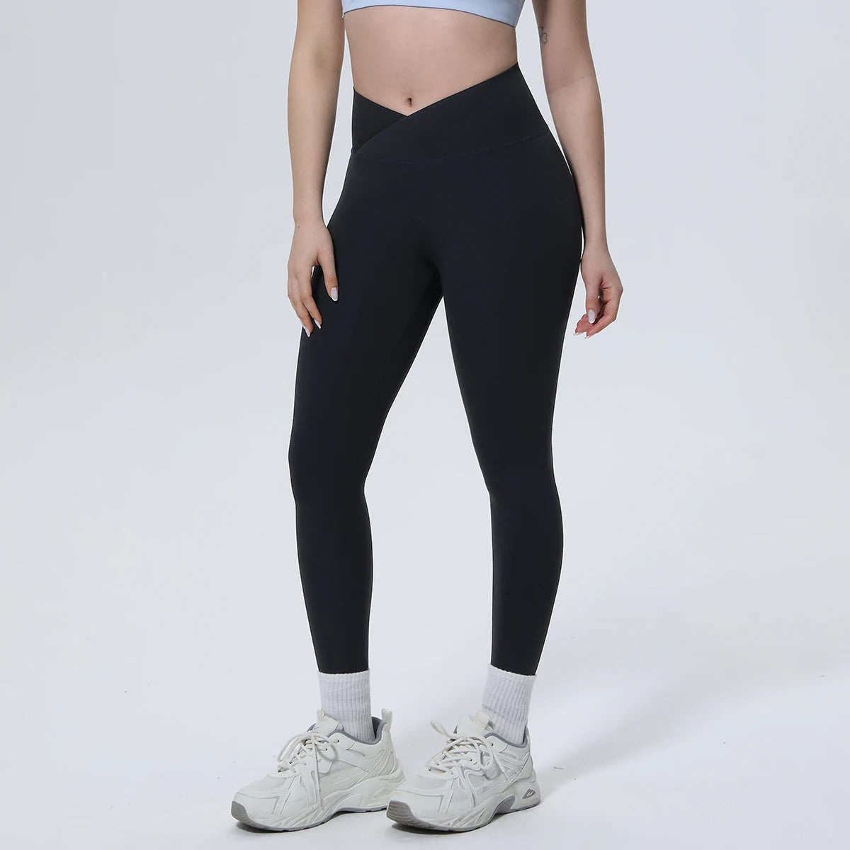 Schwarze Yoga-Leggings mit Cross-Waist-Bund, blickdicht und figurbetont