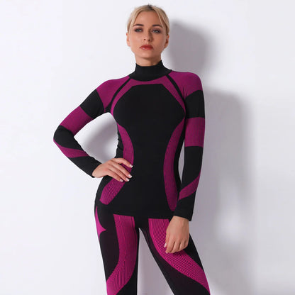 Nahtloses Sportoberteil für Damen in Schwarz/Bordeaux mit hochgeschlossenem Kragen und Langarm.