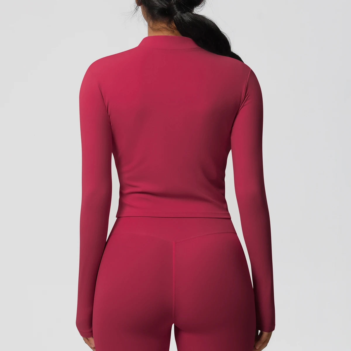 Langarm-Fitnessoberteil, Slim Fit, magenta, Rückenpartie mit glattem Schnitt