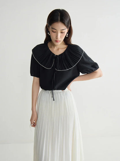 Elegante schwarze Bluse mit französischem Flair und figurformender Silhouette – Sommer-Textur für große Größen