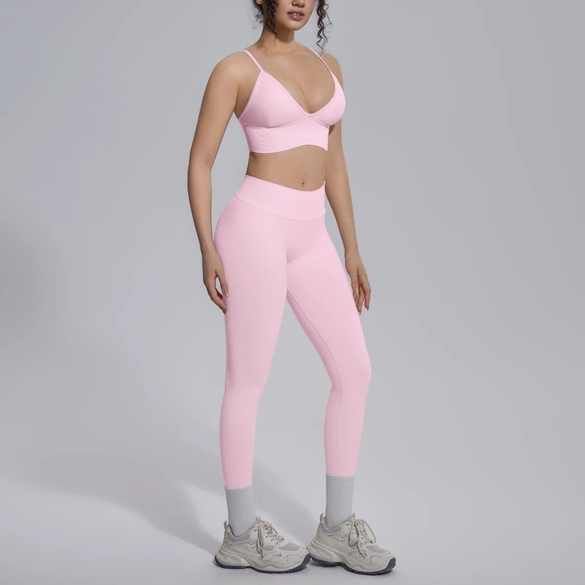 Hellrosa Yoga-Set für Damen: gepolsterter Sport-BH und lange Leggings