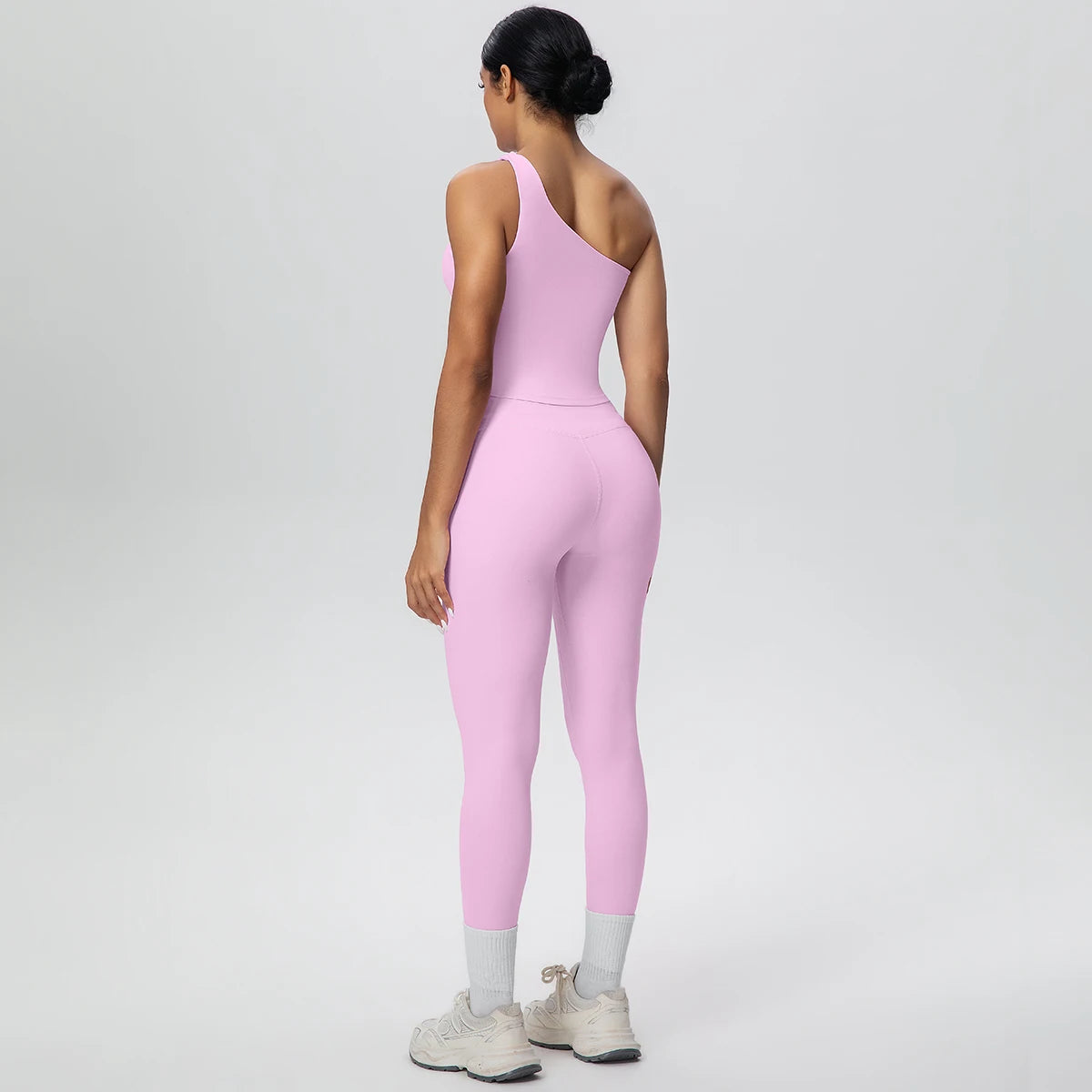 Rosa Yoga-Set mit High-Waist-Leggings und Sport-BH, Rückansicht mit breiten Trägern