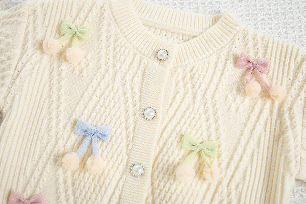 Mädchen Strickjacke in Candy-Farbe mit Bogen für den Herbst