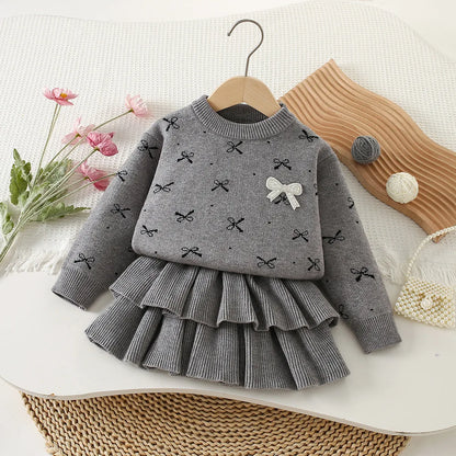 Mädchen Kleidungsset mit Bogen Druck Pullover und Faltenrock im 2-Teile Design