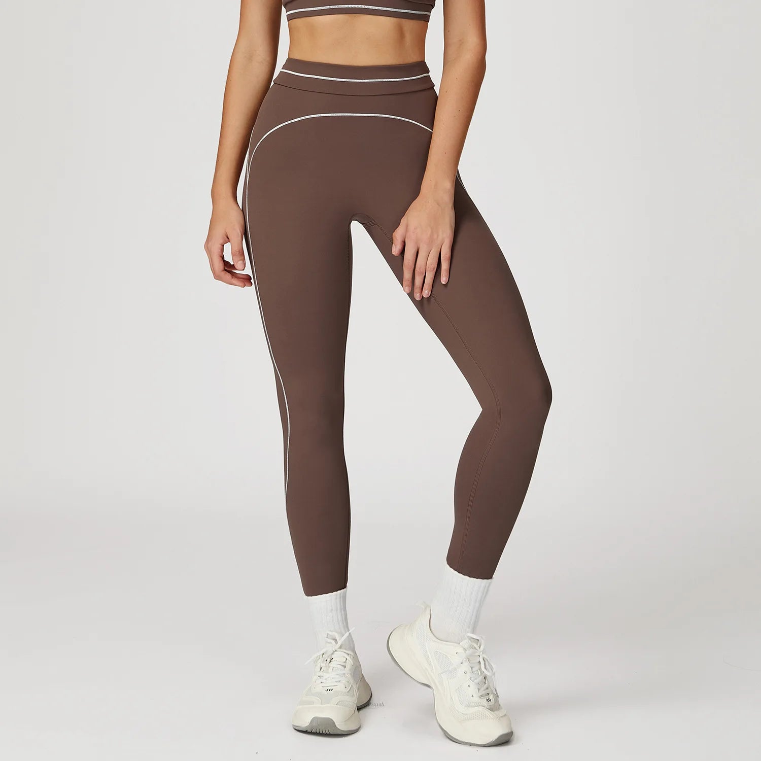 Damen Yoga-Leggings in Braun mit Kontrastlinien an den Seiten und hellem Bund