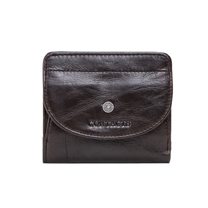 Kleine Damen-Geldbörse aus Leder, dunkelbraun mit Münzfach-Klappe und Logoprägung.