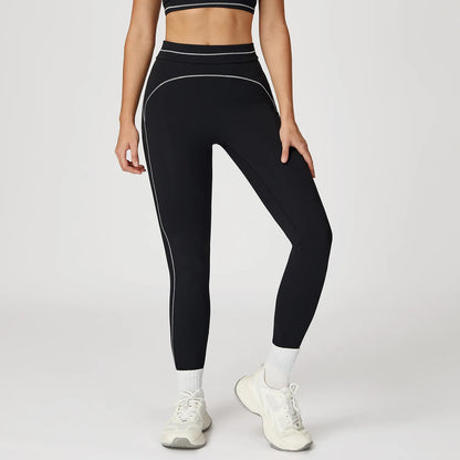 Damen Fitness-Leggings in Schwarz mit hellen Kontrastnähten am Bein und Bund