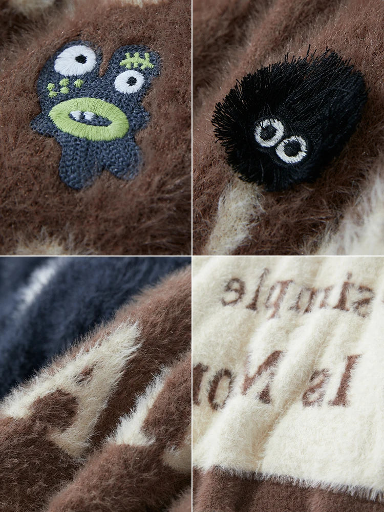 Damenpullover-Detail mit Zierapplikationen und Schrift-/Buchstabenprint in Flauschoptik