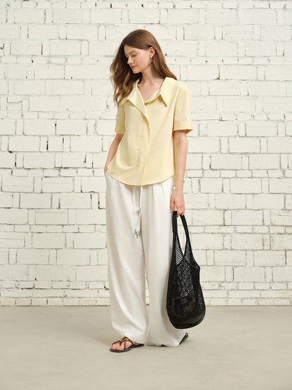 Kurzärmeliges Patchwork-T-Shirt mit Kontrastfarben und Karomuster – modischer Allrounder für den Sommer.