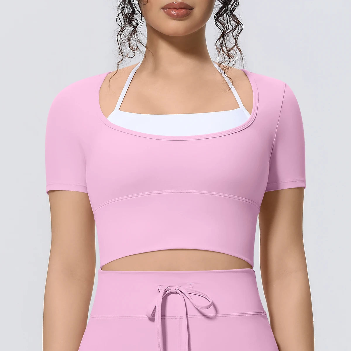 Damen Sport-T-Shirt, rosa, Frontansicht mit Racerback-Look und nahtbetonter Taille