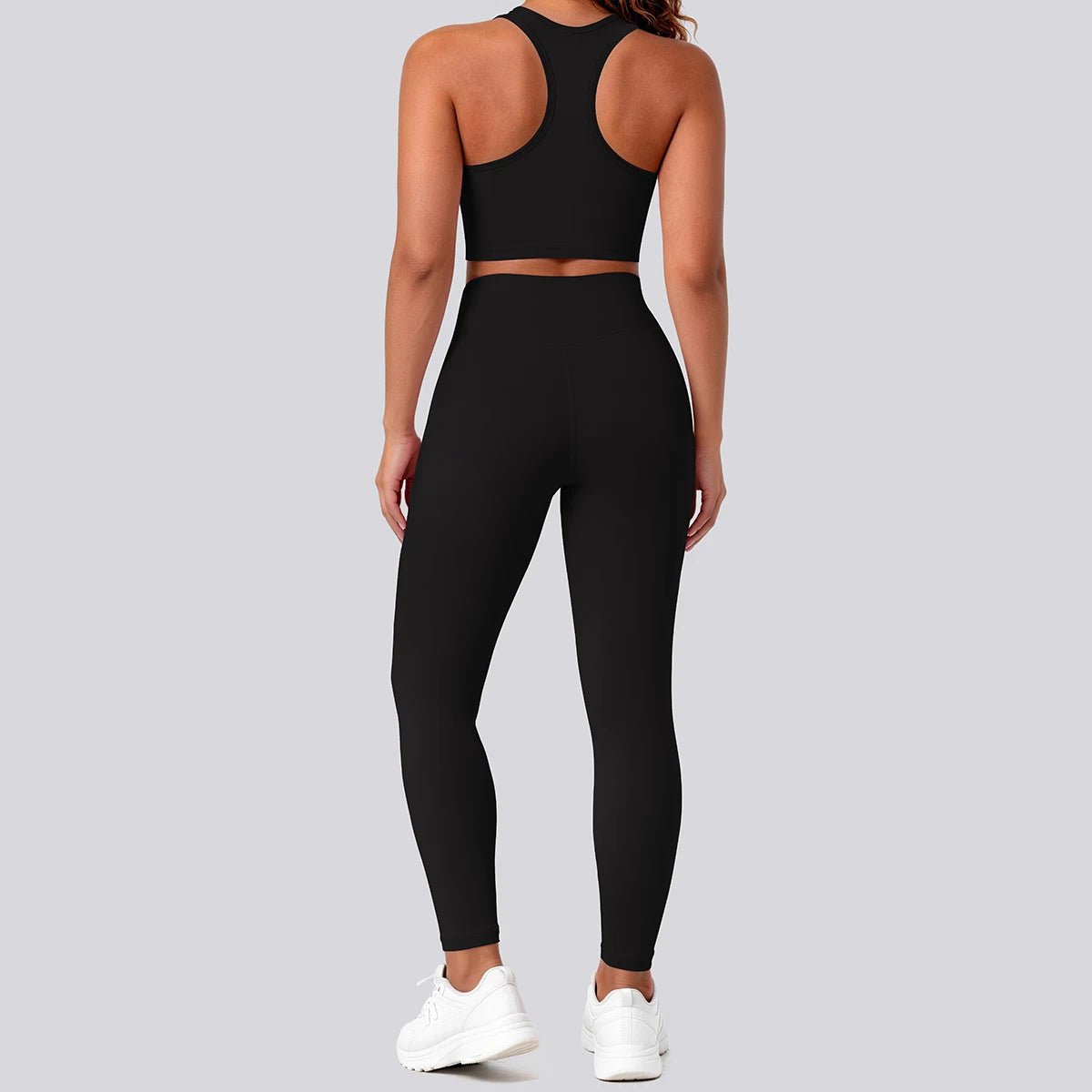 Schwarzes nahtfreies Yoga-Set: Racerback-Sport-BH und High-Waist-Leggings