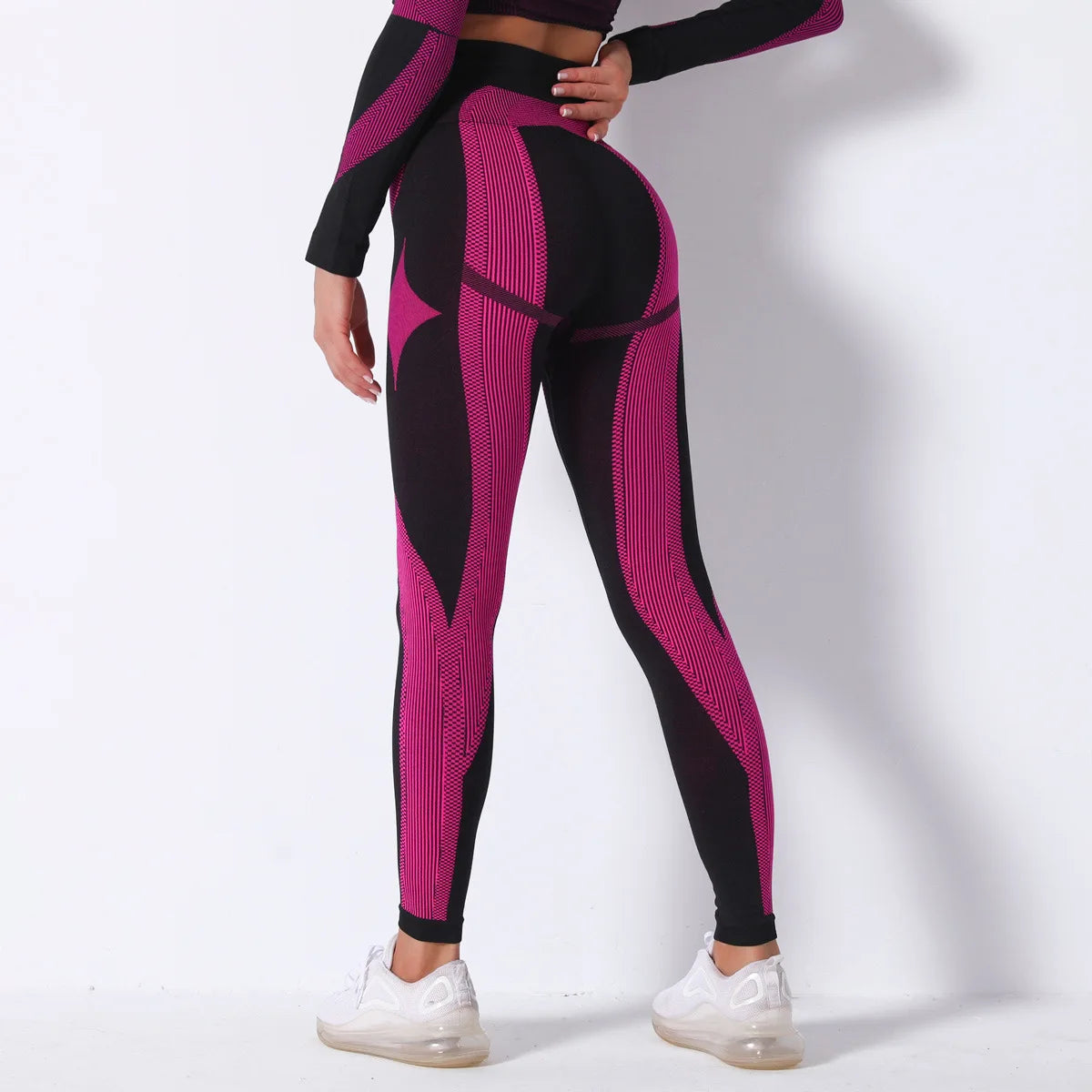 Hamidou nahtlose Yoga-Leggings, schwarz mit fuchsiafarbenen Musterstreifen