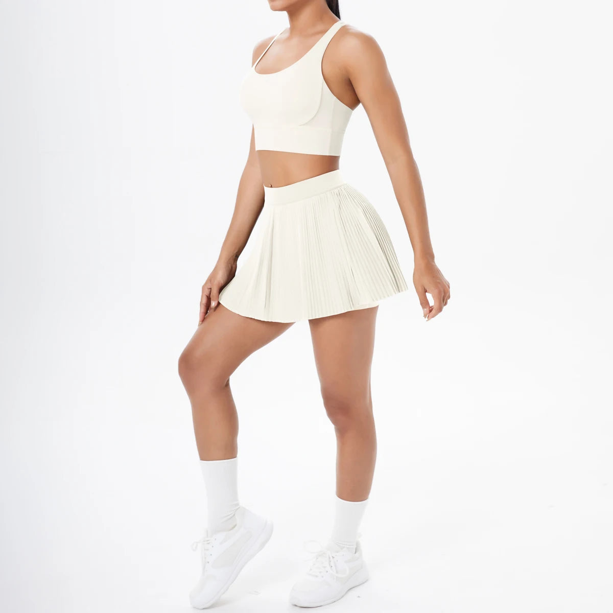 Sportset mit Sport-Bustier und Faltenrock, hellbeige, Vorderansicht