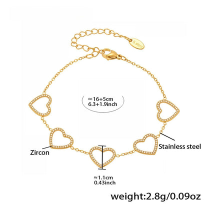 Damen-Charm-Armband mit Herzschleife und Zirkonia