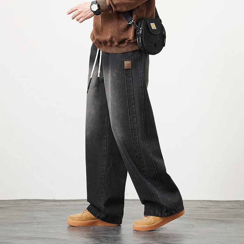 Männer Jeans mit elastischer Taille in schwarz-blauer Farbgebung im Hip Hop Stil