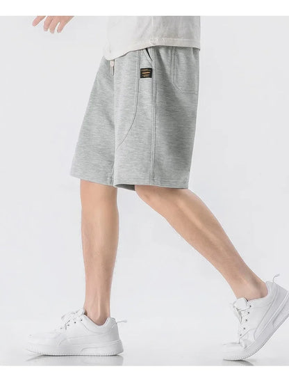 Leichte Herren-Strickjacke mit Waffelstruktur, Taschen und Reverskragen – ideal für Frühling und Herbst.
