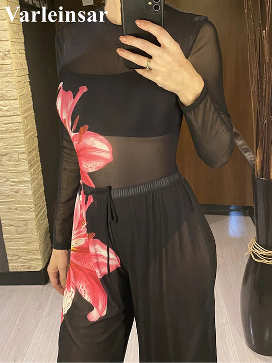 Damen-Badeanzug: schwarzes Langarmteil mit pinkem Blumenprint und Hose