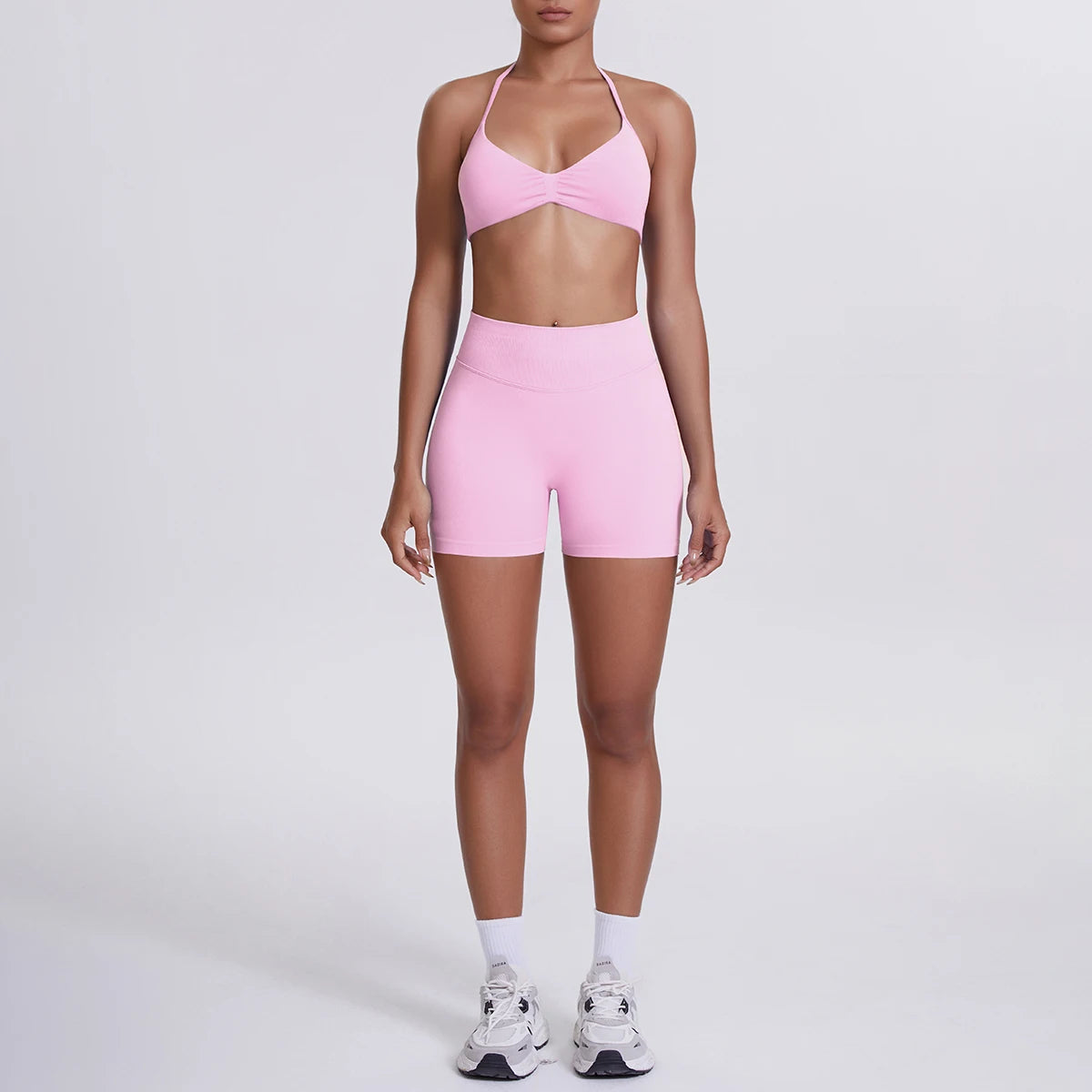 Nahtloses Yogaset für Damen: rosafarbenes Top mit High-Waist-Shorts